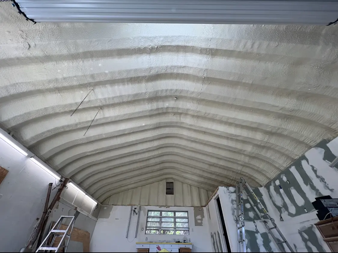 Spray polyurethane foam applied to the underside of a metal roof deck in New Smyrna Beach